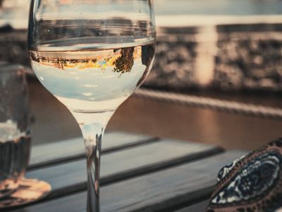 Close-up of a glass of water and a towel.